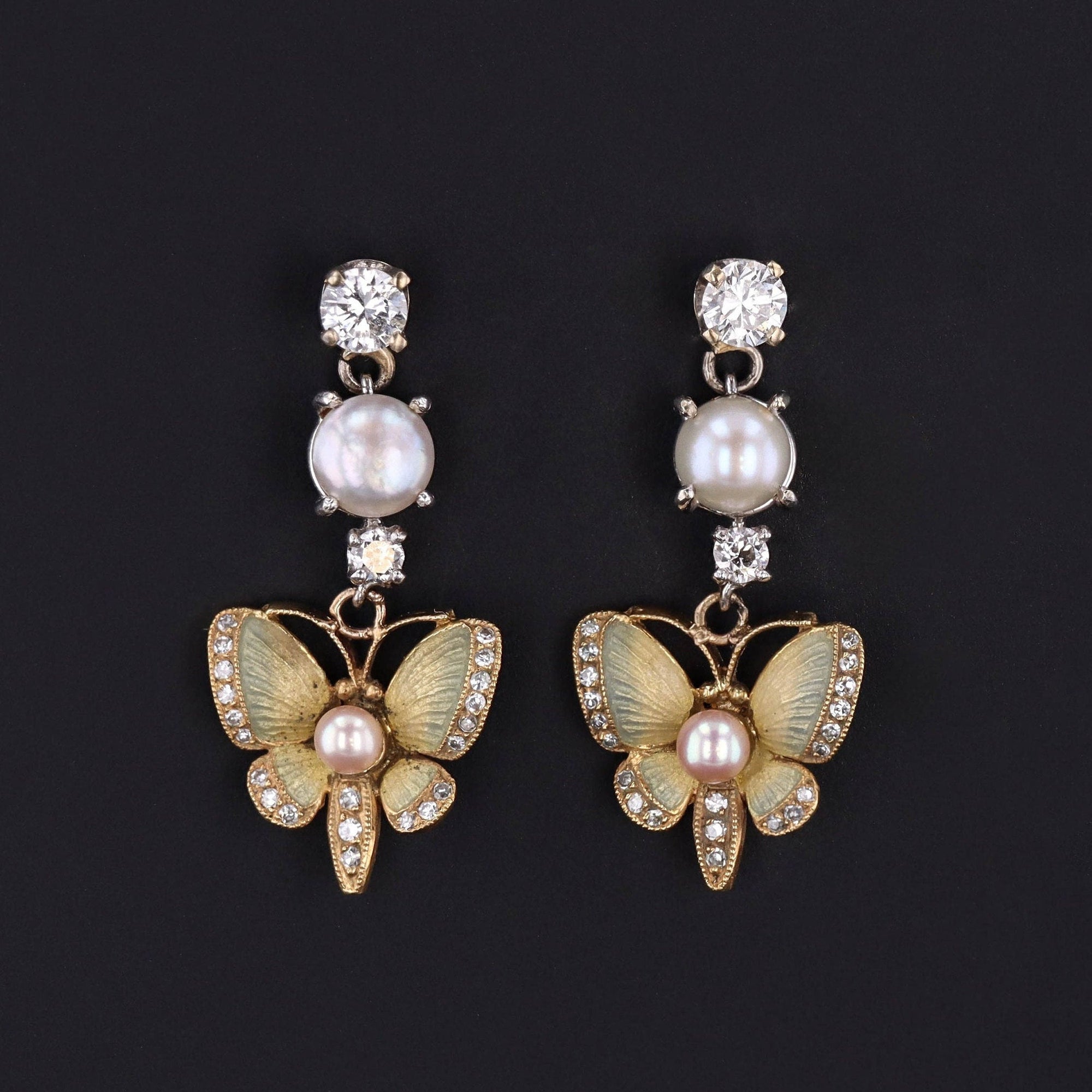 Antique pale green butterfly dangle earrings of gold with pearls and diamonds.
