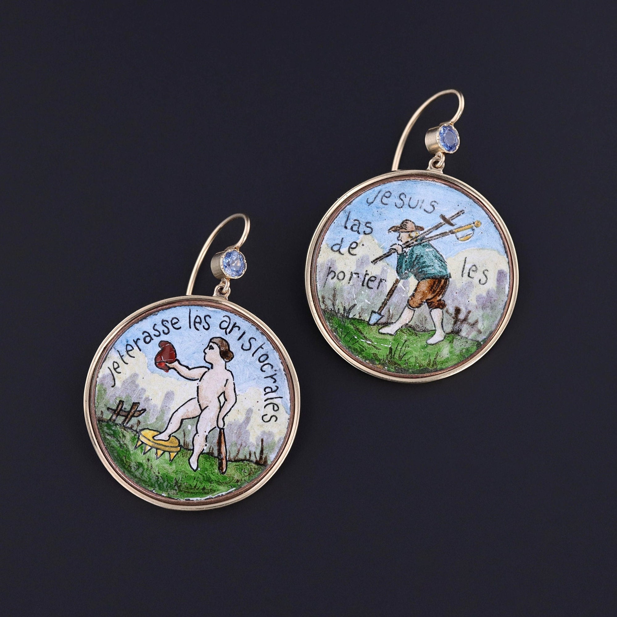An extraordinary pair of earrings created from very rare buttons dating to the time of the French Revolution (1789-1799). Our jeweler added 14k gold backs and ear wires with sapphire surmounts.