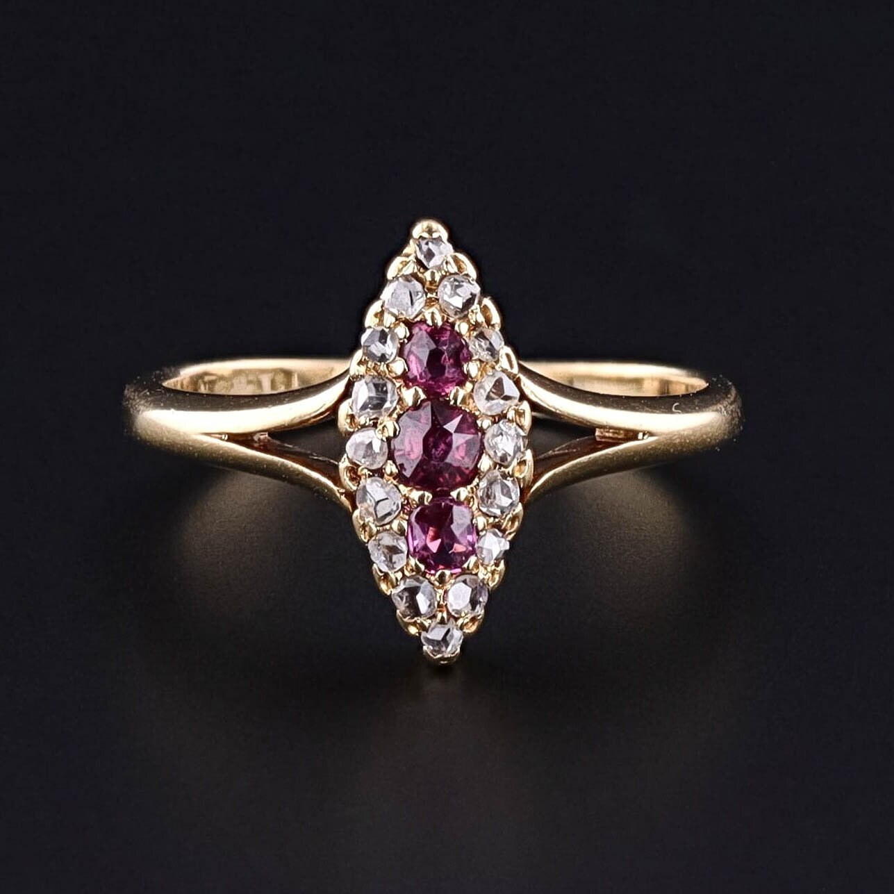 A ruby and diamond navette ring from the late Victorian era - circa 1890. The ring is 18k gold and can be re-sized.