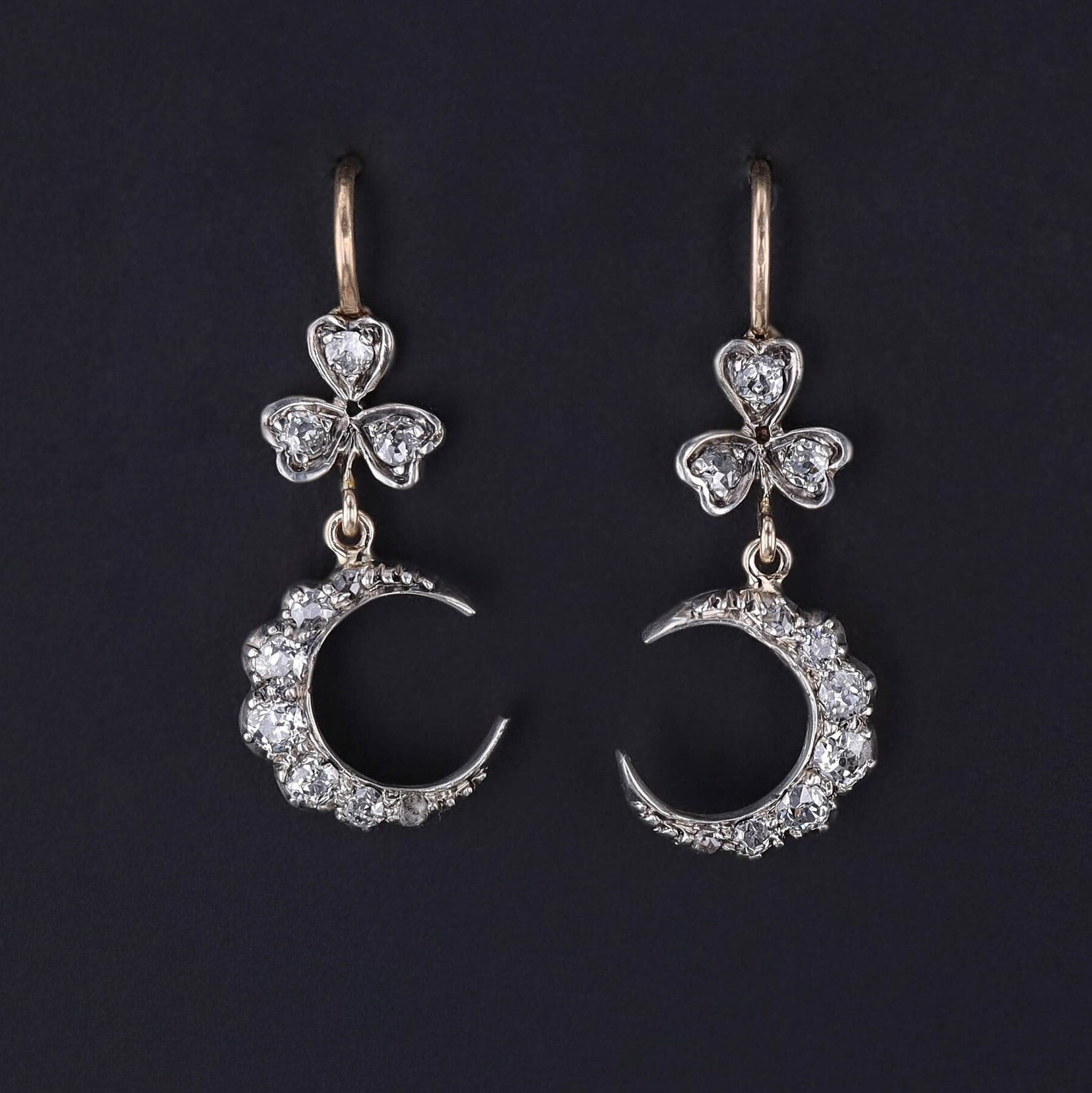 Diamond Crescent Earrings: These exquisite earrings adorned with old mine cut diamond crescents and clovers. The diamond drops are silver topped 14k and were originally antique brooch components dating to 1890. The ear wires are new additions.