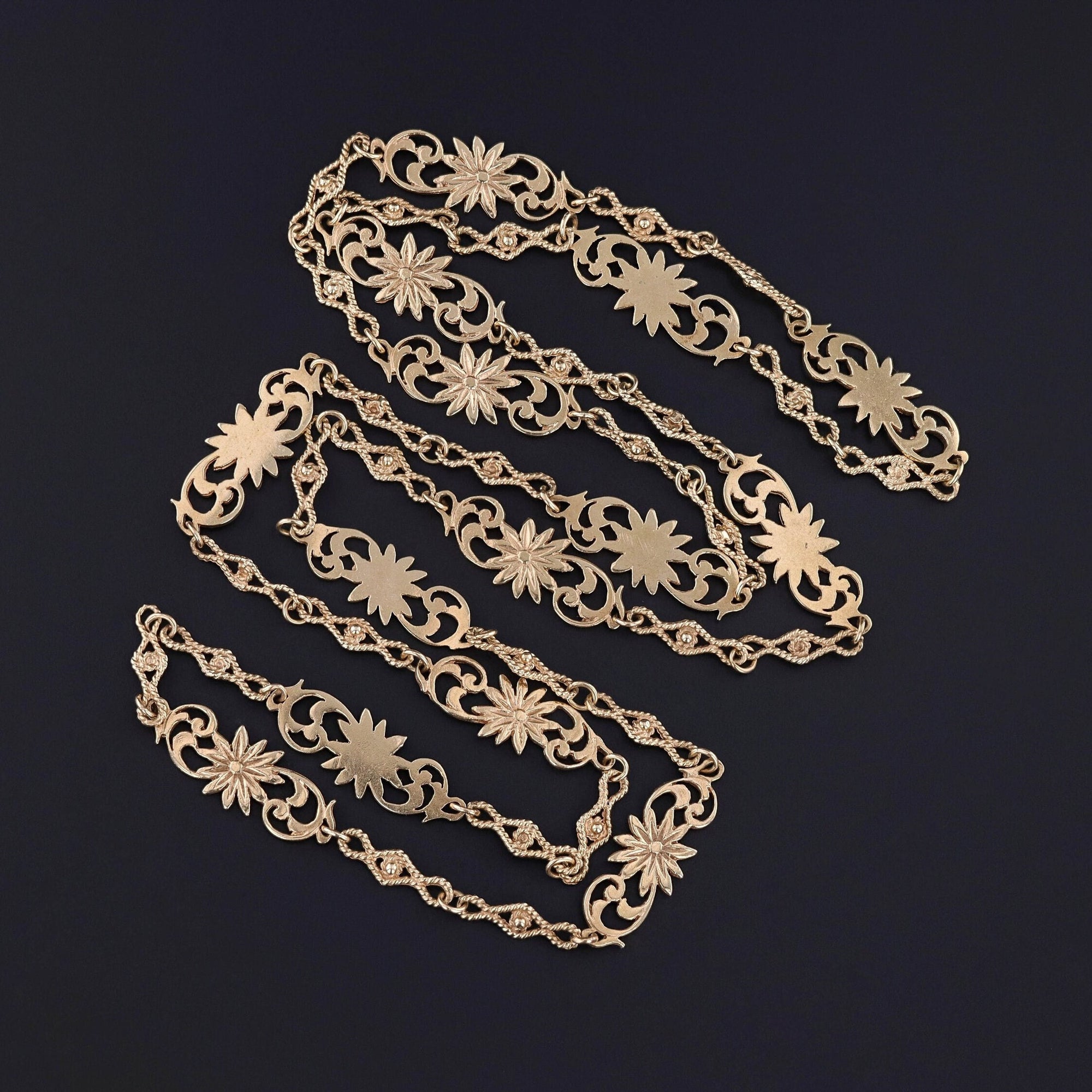 A Victorian era 14k gold floral link chain. The chain is in great condition and measures 29 inches.