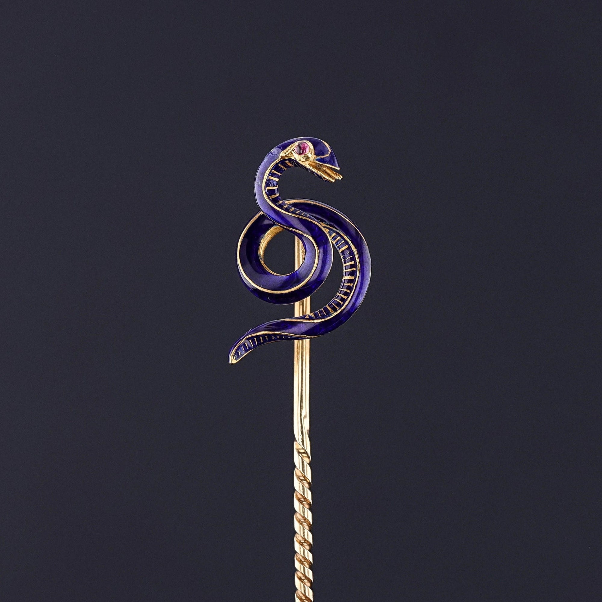 An antique enamel snake stickpin from the late Victorian era (circa 1870). The pin is in very good condition with a small bit of restoration on the reverse of the piece. A perfect gift for any man or woman. Unisex jewelry at its finest.