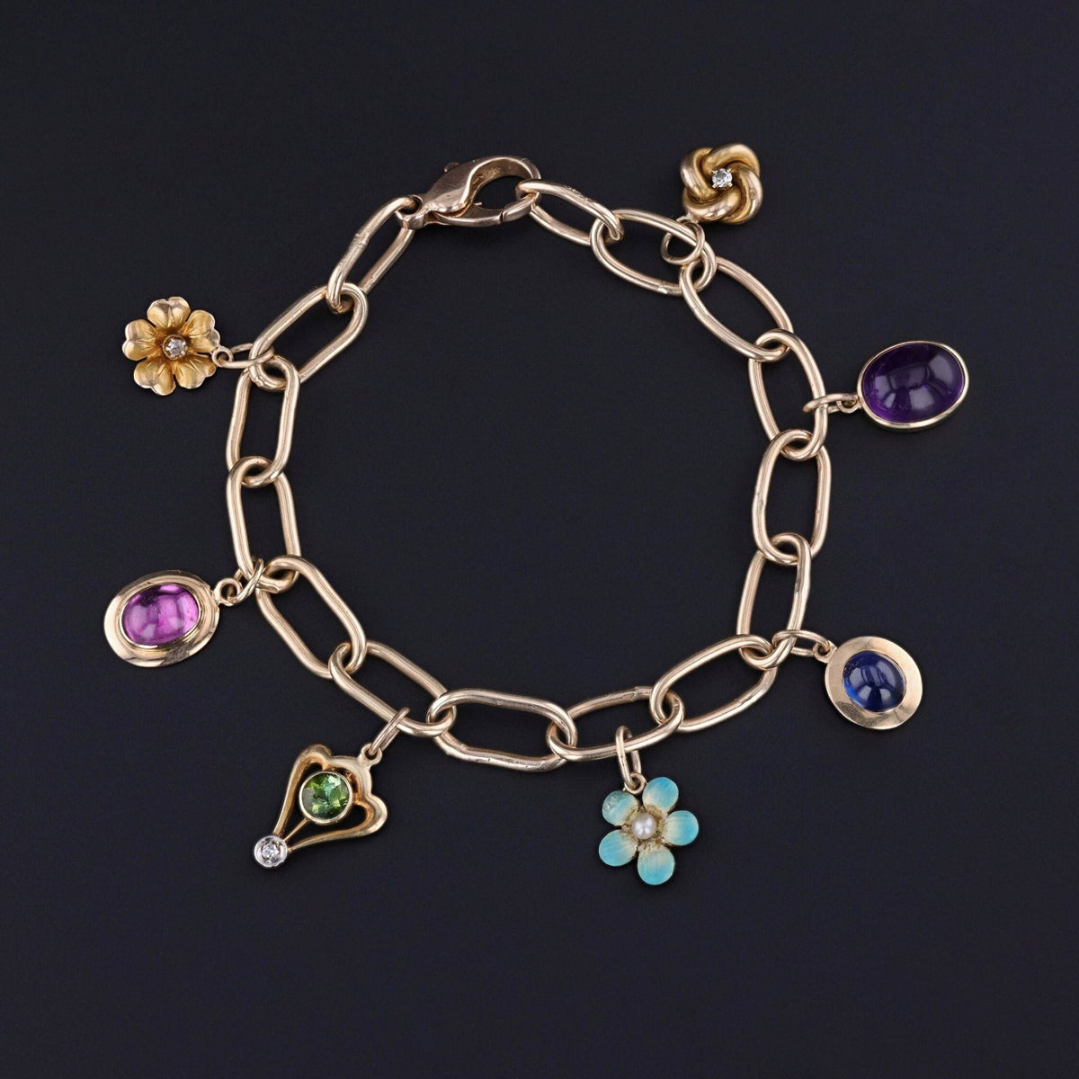 14k Gold Charm Bracelet with 7 Antique Charms - Trademark Antiques