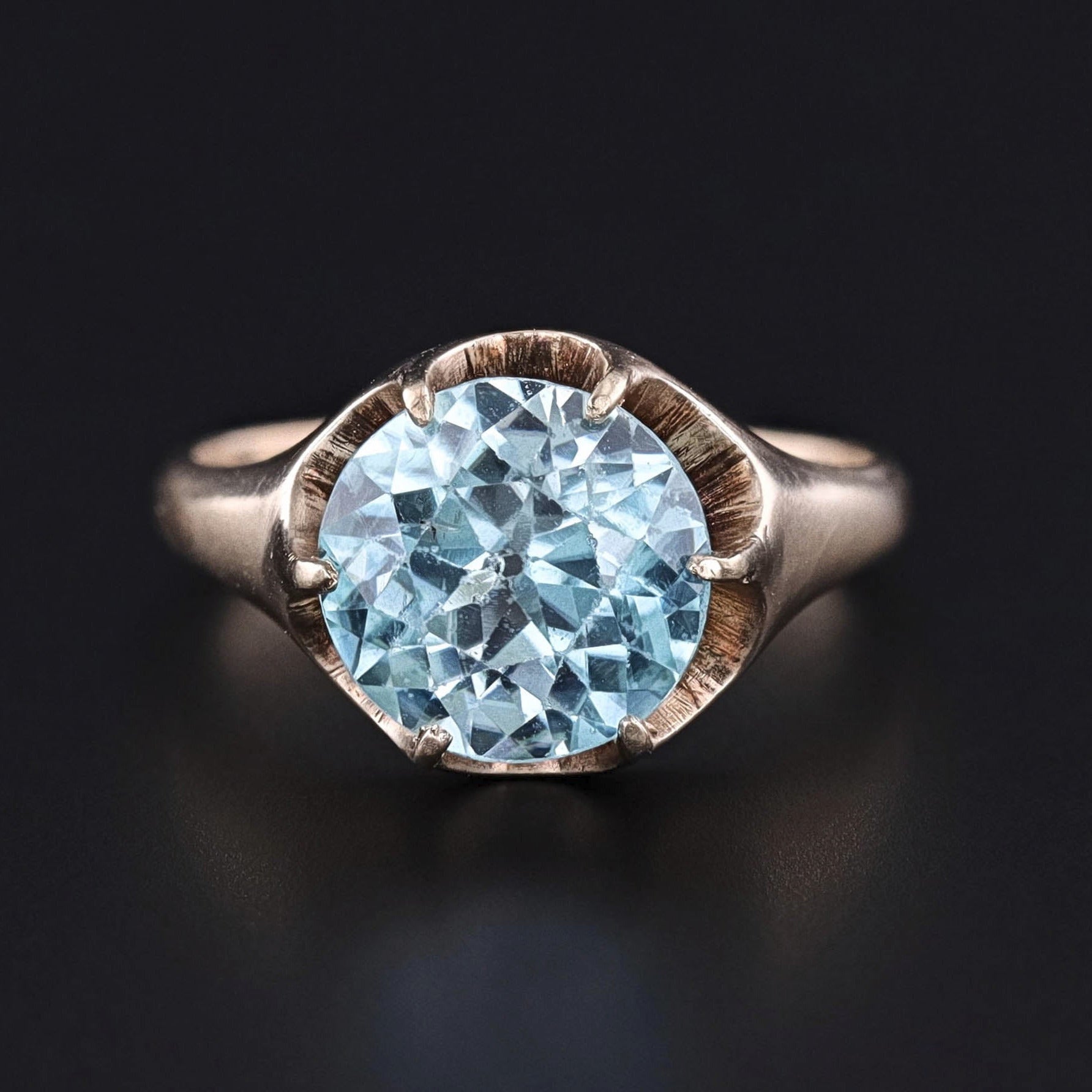A dazzling blue zircon stone set in an antique, 14k gold mounting.