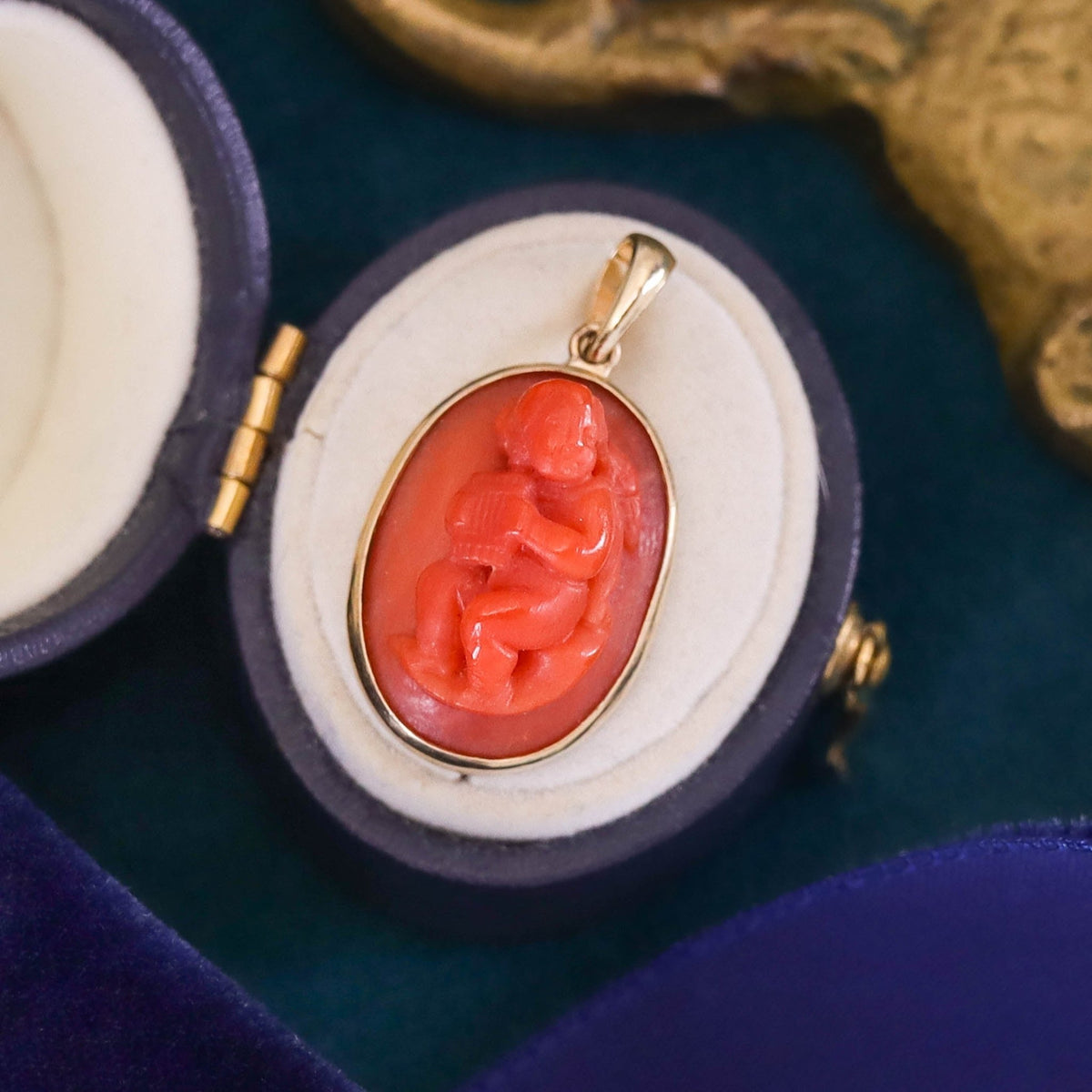 Antique Coral Cherub Pendant of 14k Gold - Trademark Antiques