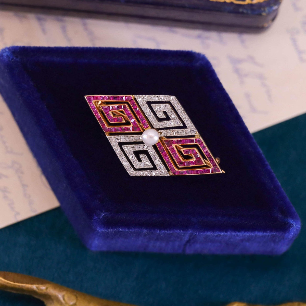 Art Deco Diamond and Ruby Greek Key Brooch of 18k Gold - Trademark Antiques