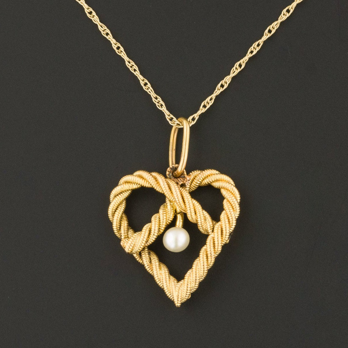 love knot necklace of 14k gold with pearl