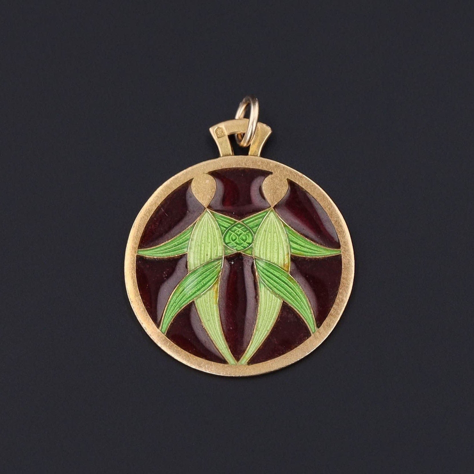 plique a jour enamel pendant depicting two people of green and red enamel and 14k gold