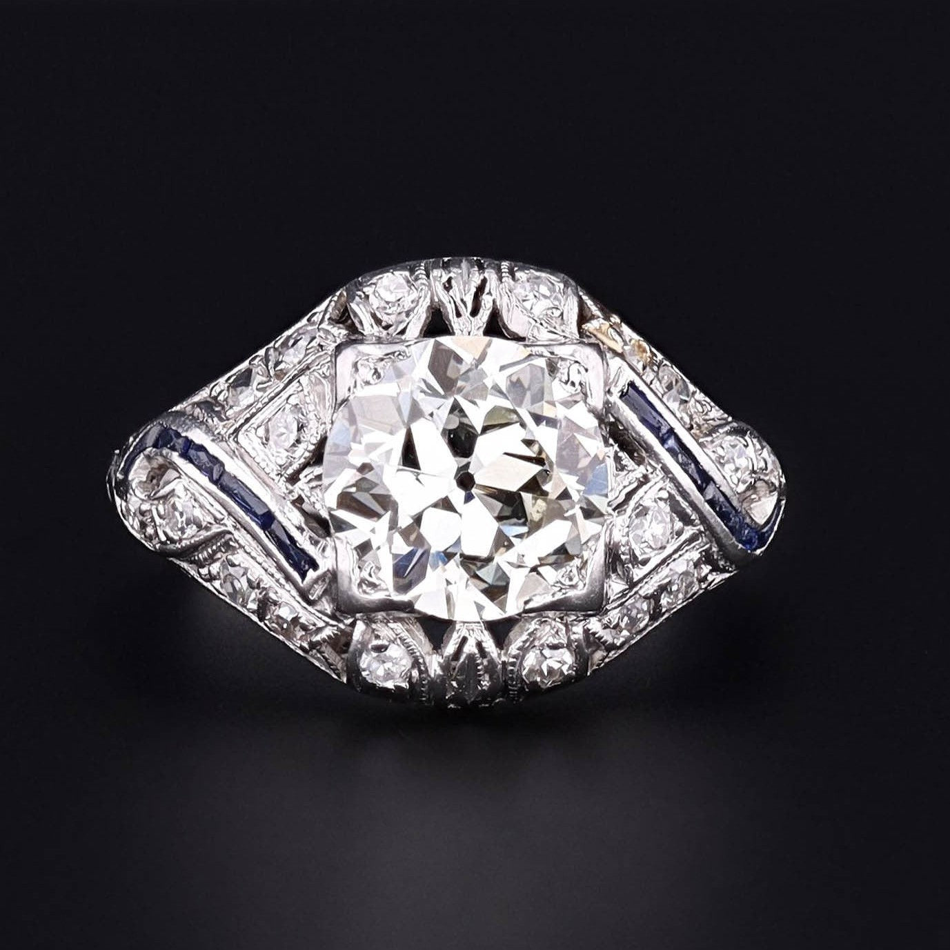 A fabulous Art Deco engagement ring featuring a 1.94 carat EGL Certified center diamond in an original platinum and diamond open work mounting. A true vintage original ring from the 1920s.