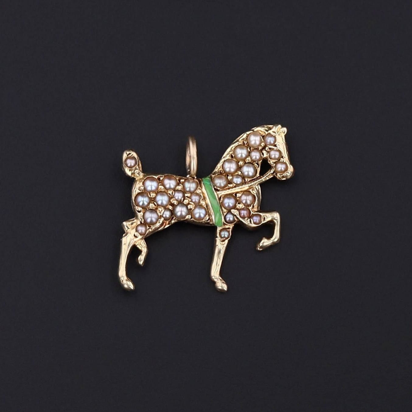 Antique Pearl and Enamel Horse Pendant: Experience the allure of antiquity with this 14k gold horse pendant, adorned with tiny half pearls and striking green enamel. Dating back to circa 1915.