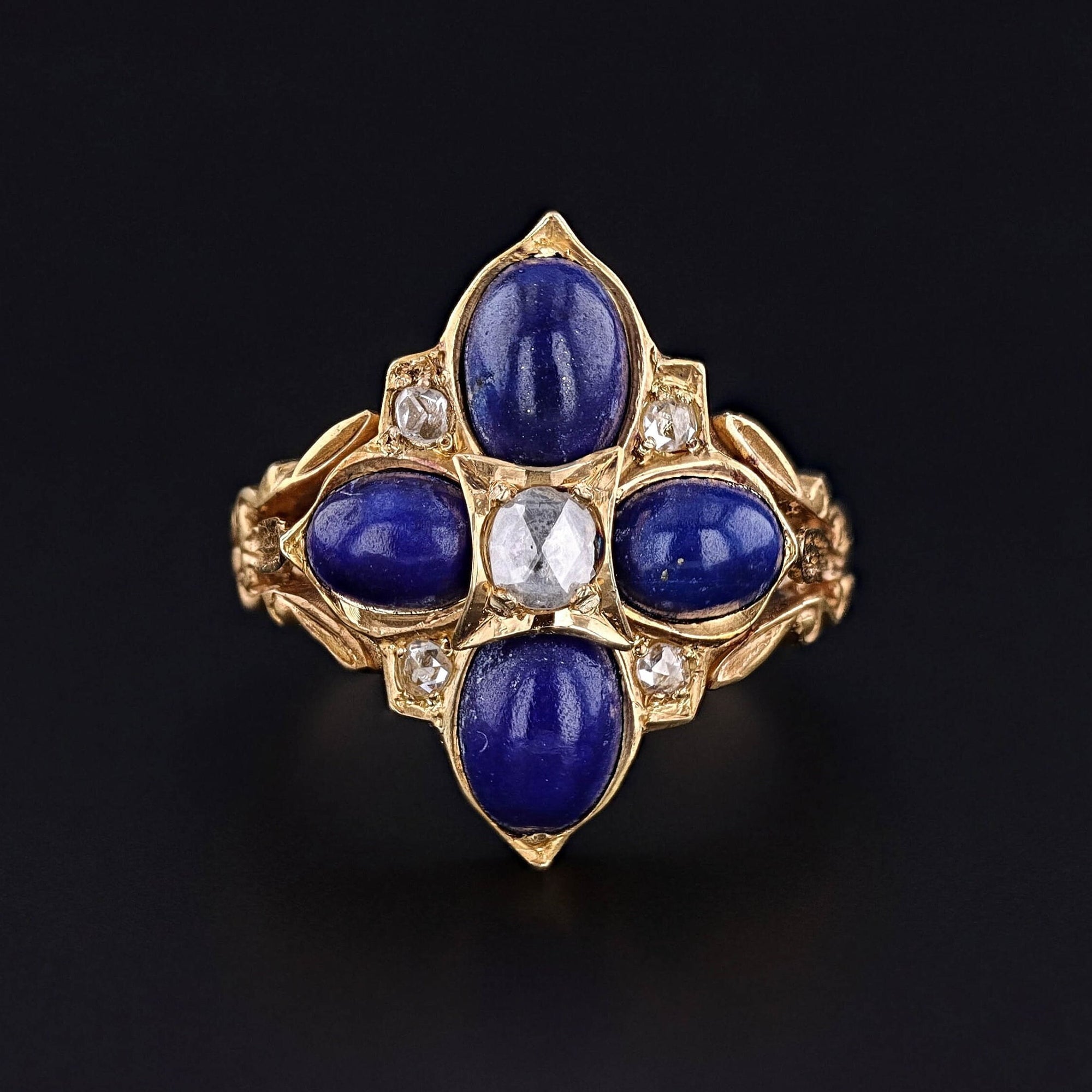 Antique Lapis Lazuli and Diamond Ring: Discover the exquisite charm of this antique ring dating back to the late 1800s. The 15ct gold ring is adorned with four vibrant lapis lazuli cabochons interspersed with lively rose cut diamonds.