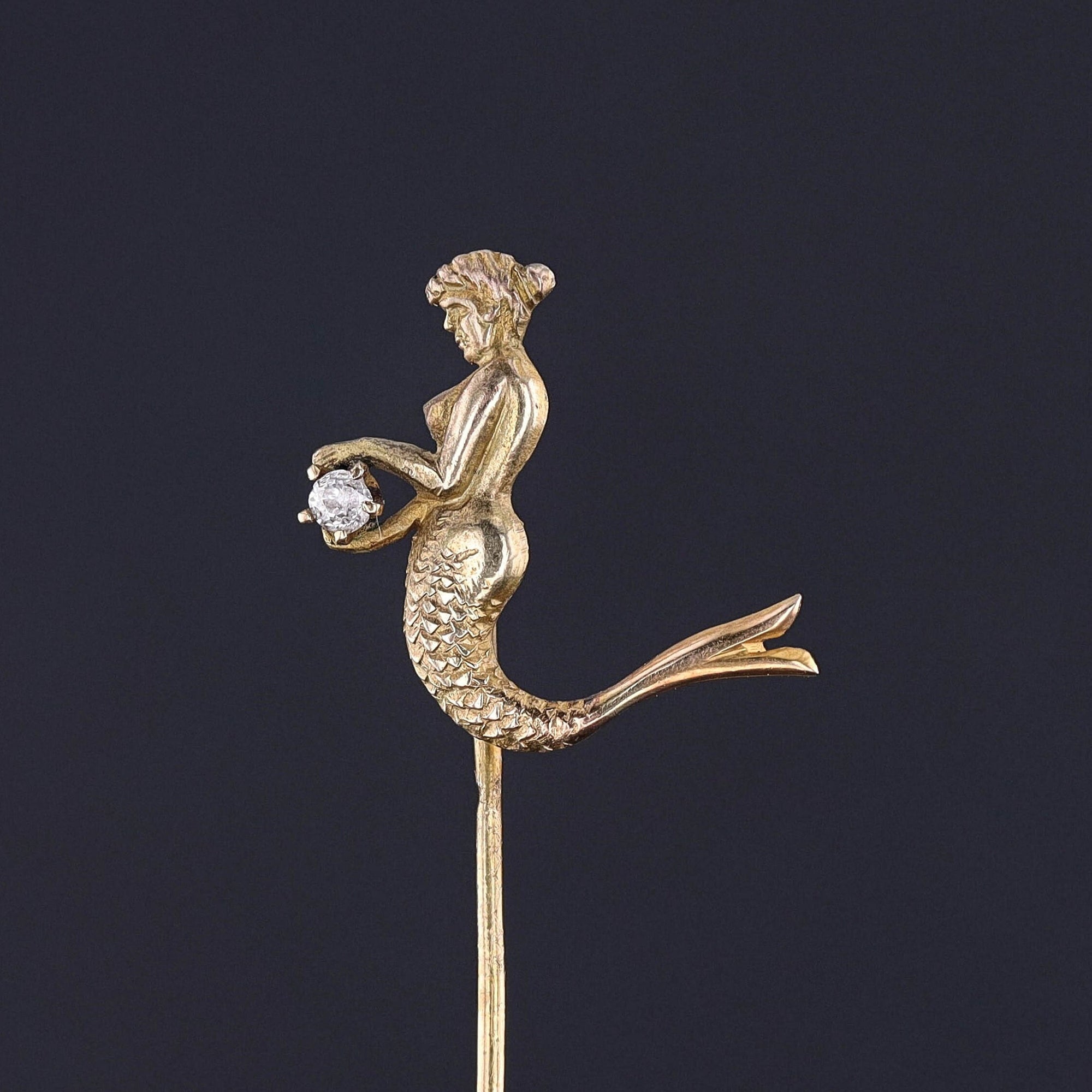 Antique 10k gold mermaid stickpin featuring diamond accent in her hands. Exceptional vintage elegance in a timeless piece.