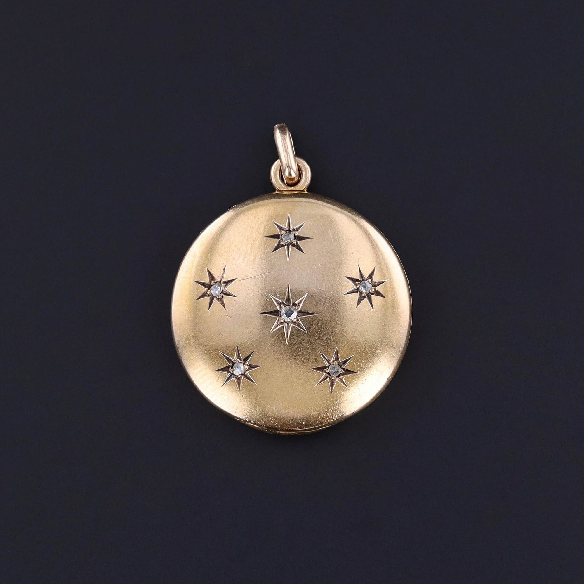 An elegant Victorian locket adorned with rose cut diamond stars. The locket opens from top to bottom and shows minimal surface wear. It is perfect for any jewelry collector or someone looking for a special keepsake to hold photos.
