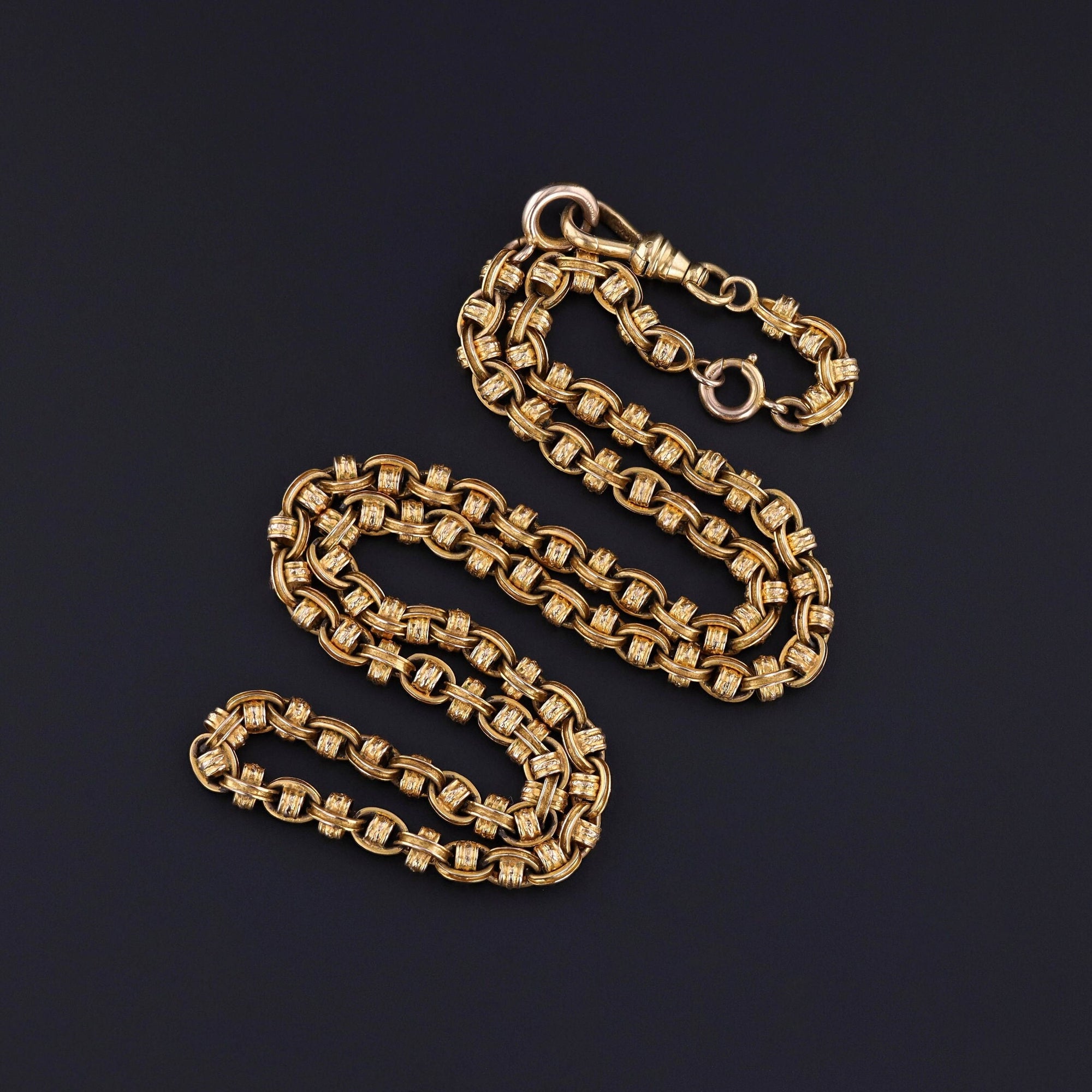 An antique fancy link chain dating to the late Victorian era (circa 1890-1900). It can be worn at 18 inches by removing the chain extender or at 20 inches (with the chain extender). It can also be worn as an 18 inch chain with a 2.25 inch drop.
