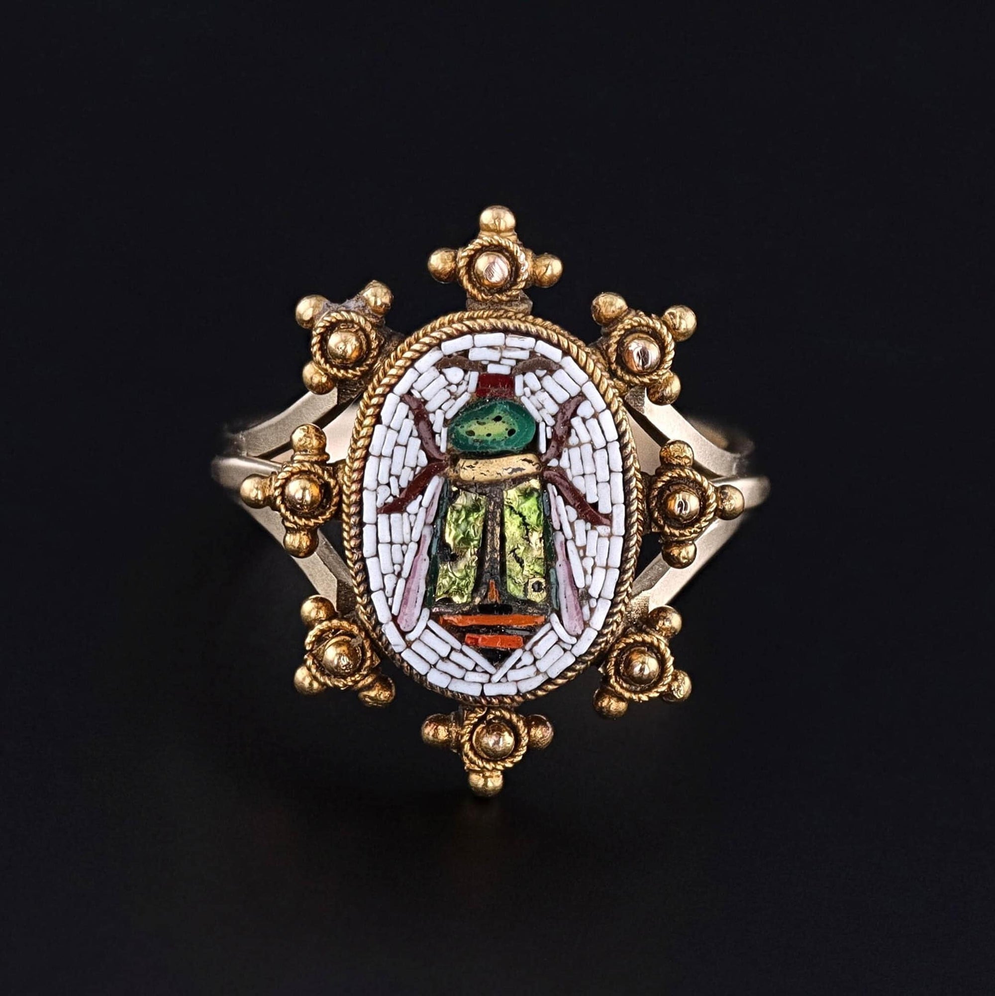 A fine micromosaic scarab ring crafted from hand-set glass tesserae, elegantly set in 14k gold. Repurposed from an antique pin dating back to 1880, our jeweler added a custom 14k gold mounting. A perfect treasure for any antique jewelry collector