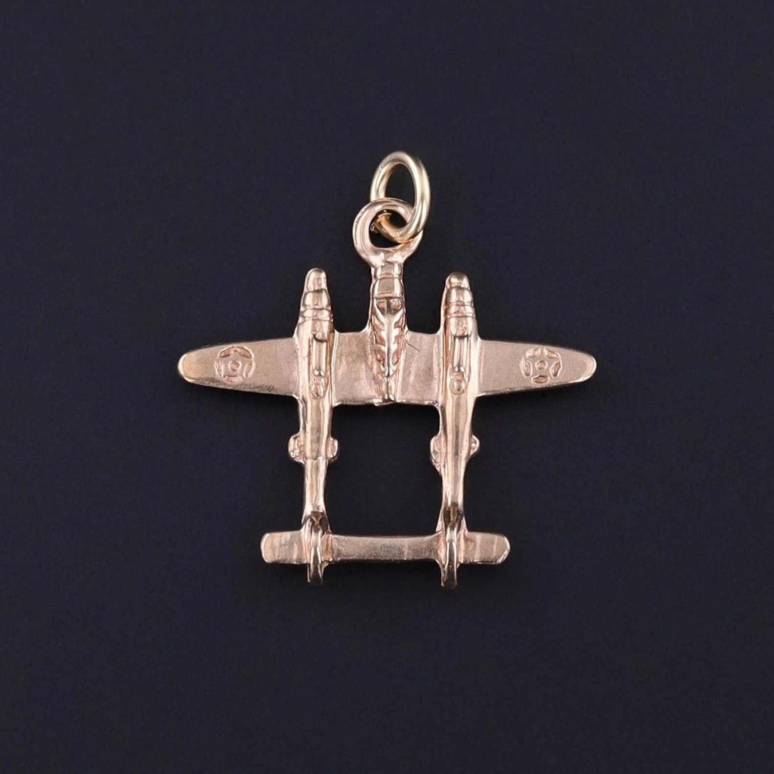 Vintage WWII Fighter Plane Charm: This vintage charm dates back to the 1940s and features a World War II fighter plane of 10k gold. A perfect gift for a collector of aviation jewelry or WWII jewelry or a charm collector.