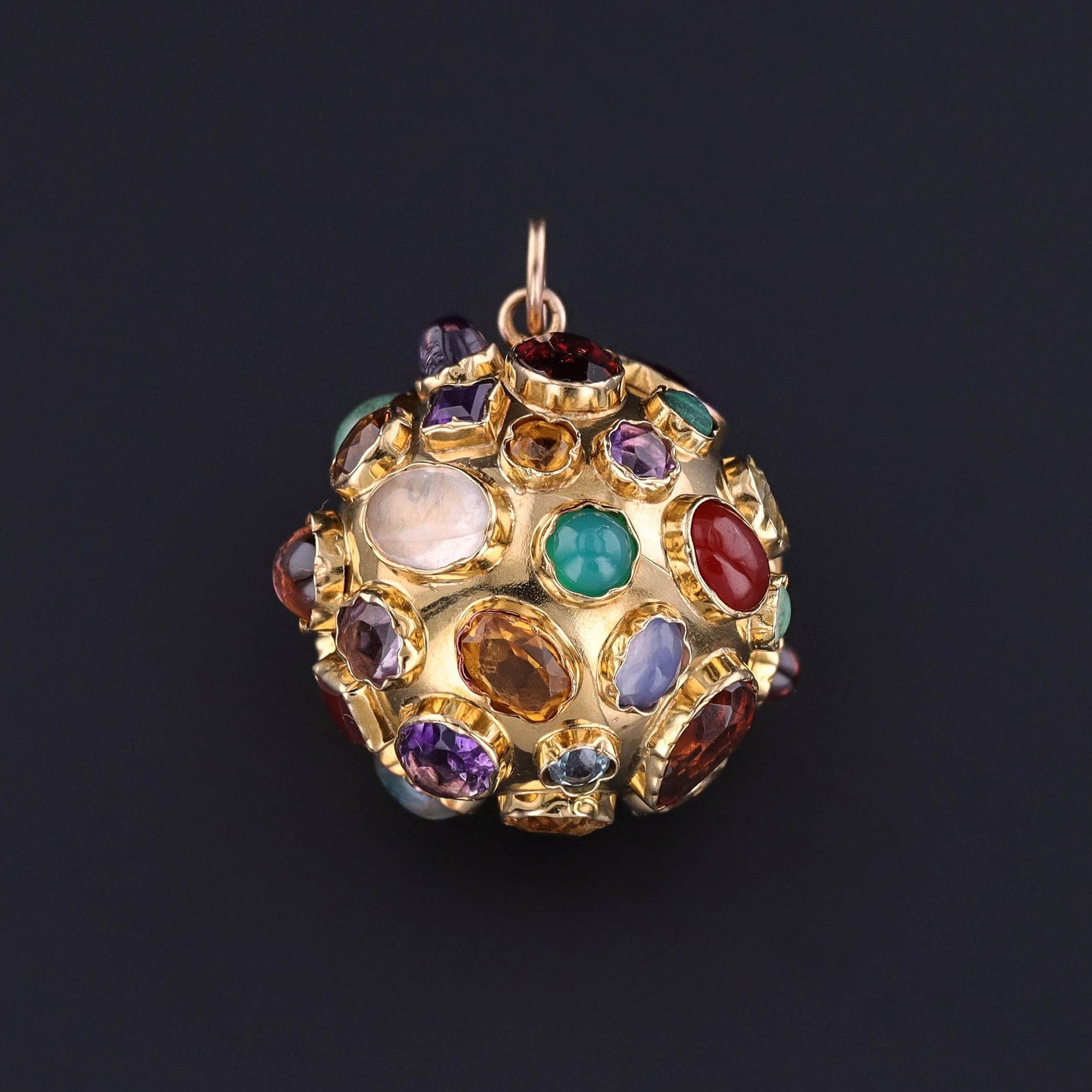 An 18k Gold and gemstone sputnik pendant from the 1960s. The vintage piece is quite large for a sputnik and in great condition. Perfect for any mid-century jewelry collector or vintage jewelry lover.