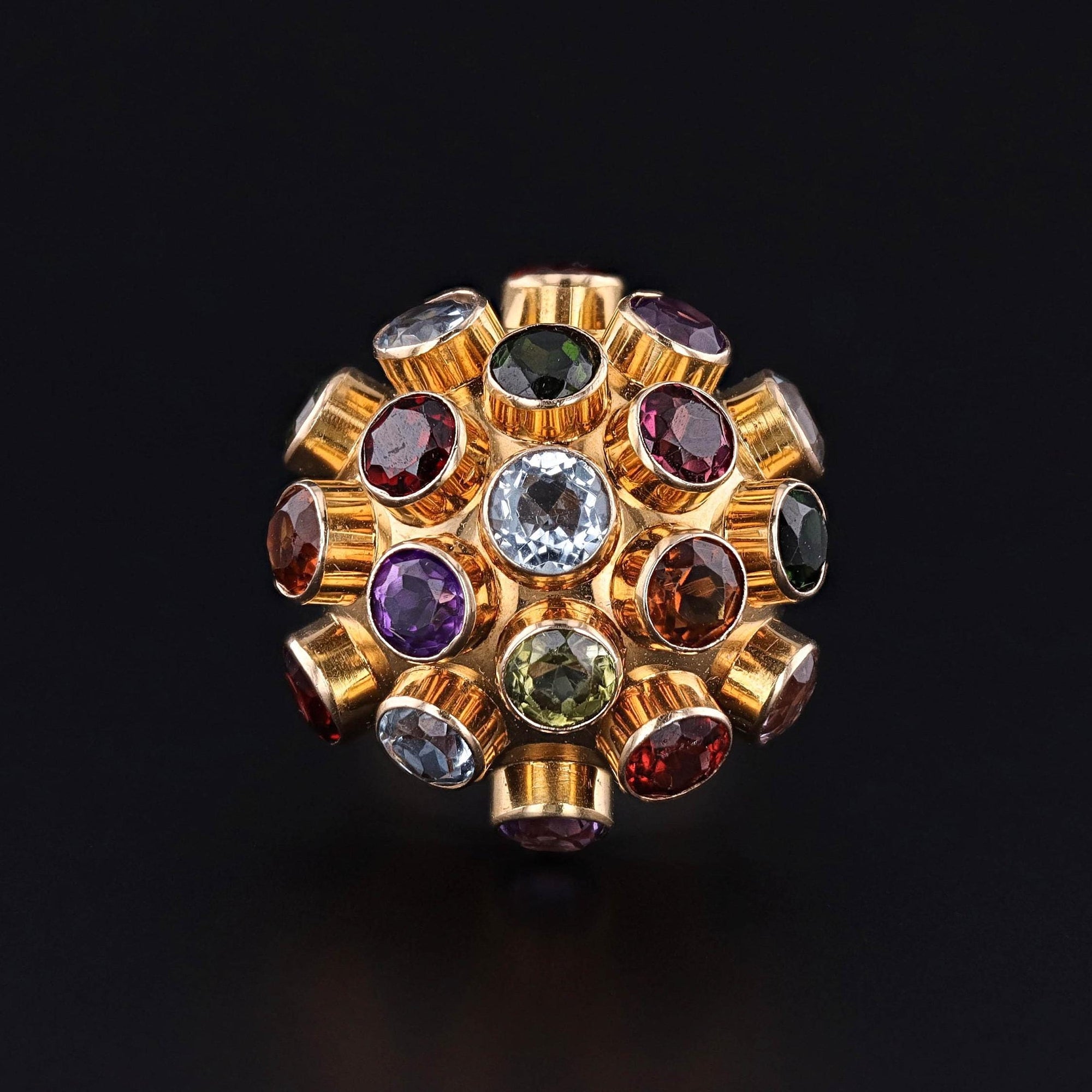 A vintage gemstone sputnik ring of 18k gold. This ring celebrates the allure of the Space Race in the 1960s and is designed to look like a satellite.