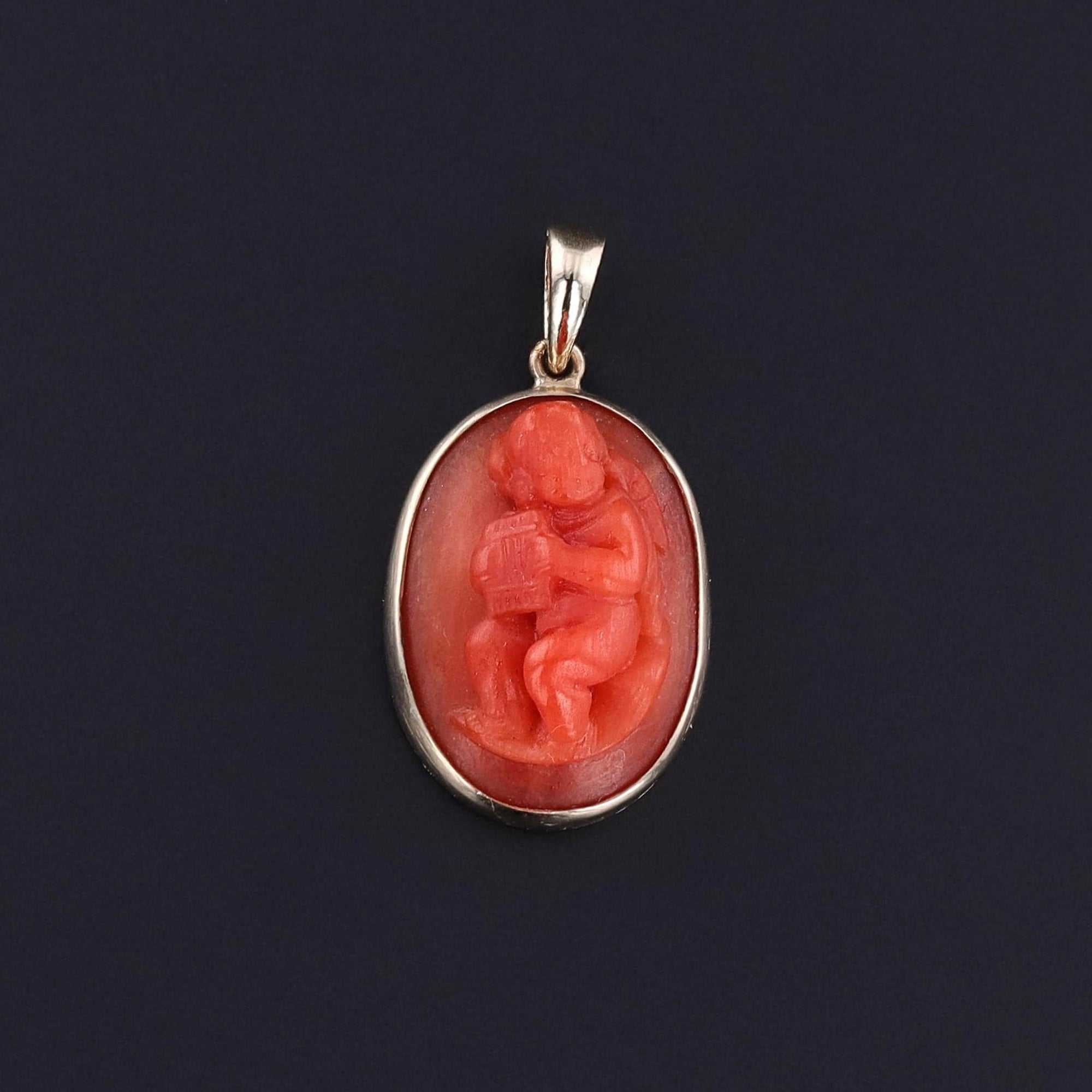 Antique Coral Cherub Pendant of 14k Gold