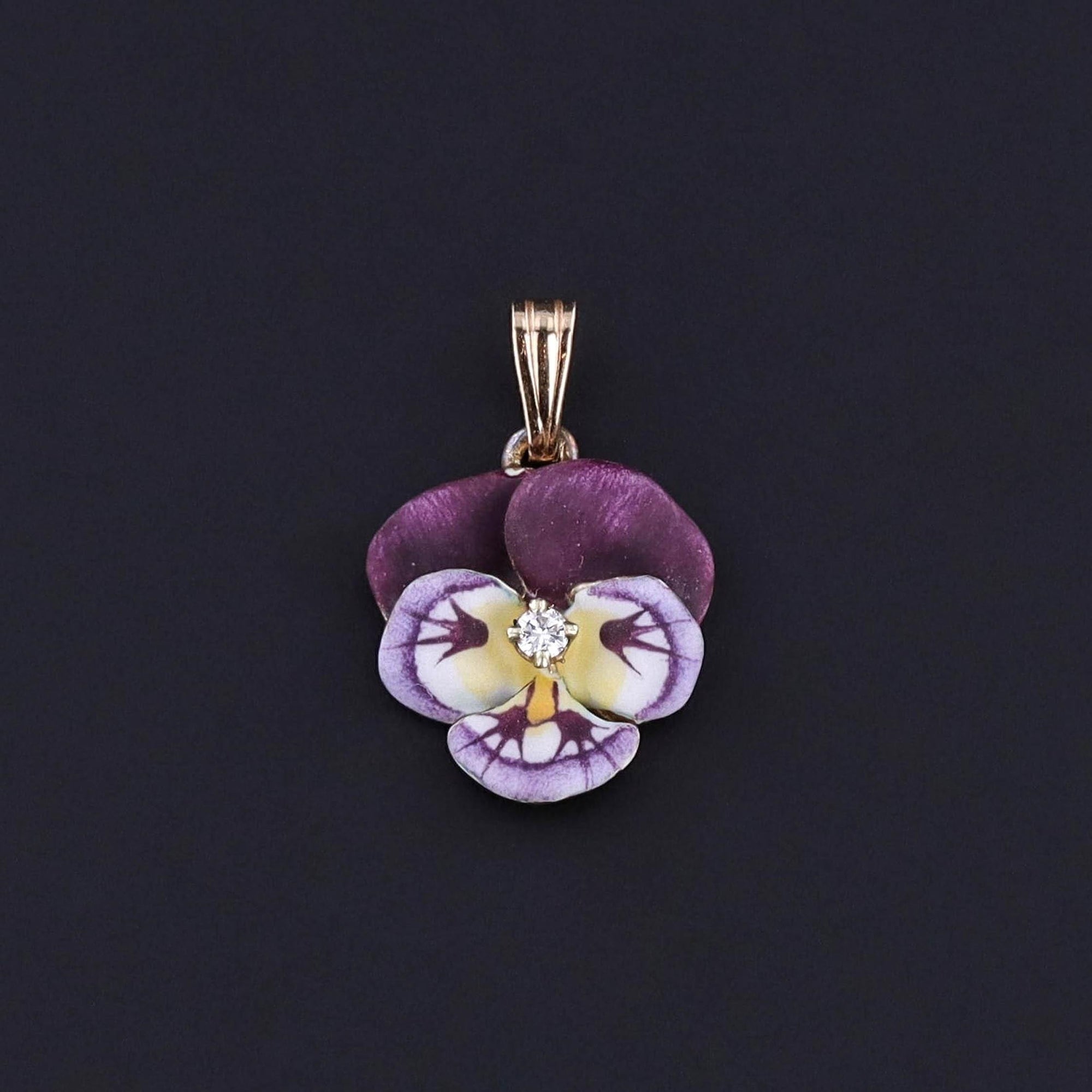 A 14k gold enamel and diamond pansy pendant.  Perfect for a chain or a bracelet.