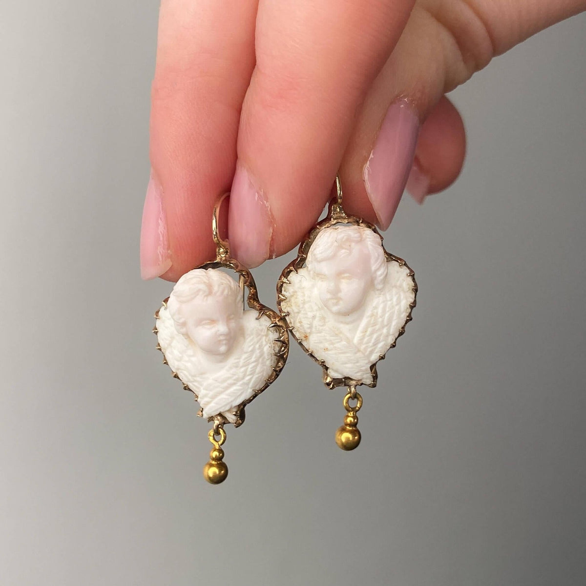 Victorian Carved Angel Skin Coral Cameo Cherub Earrings - Trademark Antiques