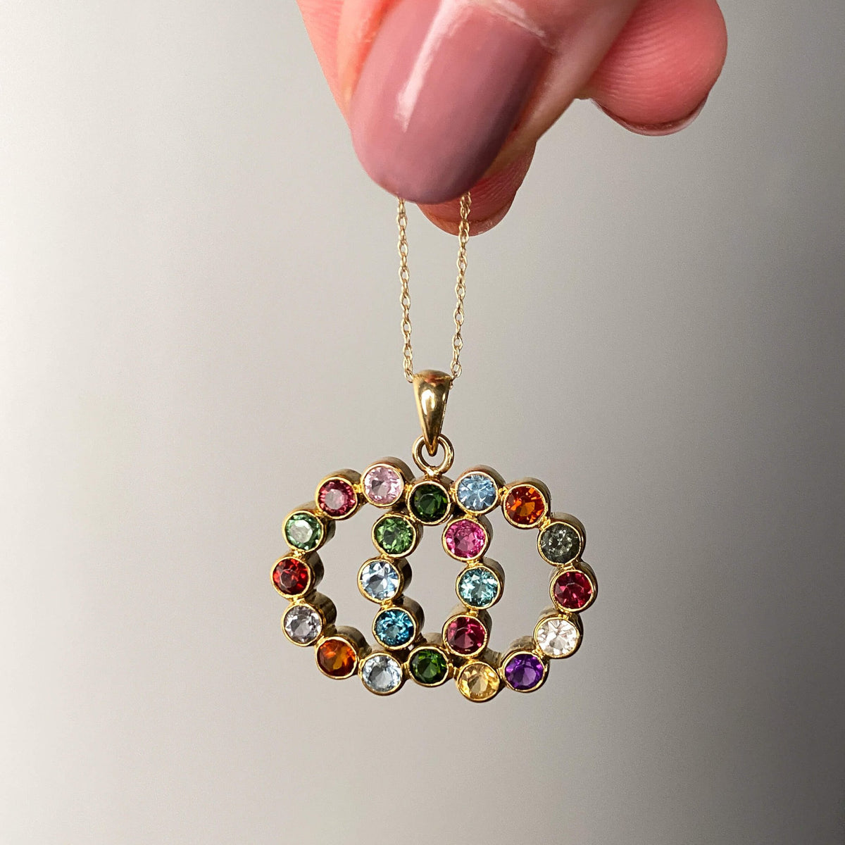 Vintage Gemstone Love Knot Pendant of 14k Gold - Trademark Antiques