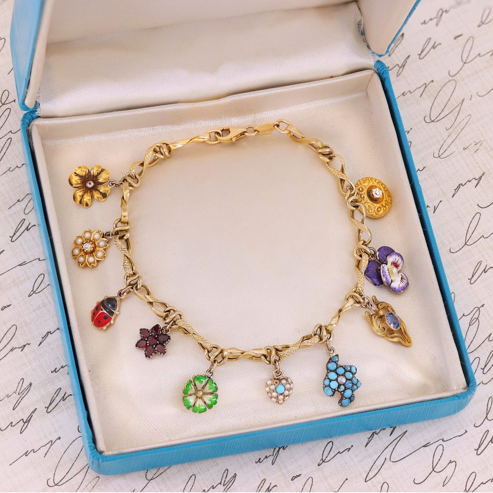 10k Gold Charm Bracelet with 10 Gemstone and Enamel Charms - Trademark Antiques
