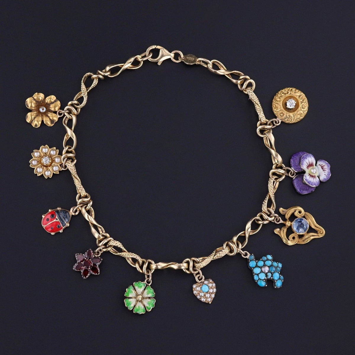 10k Gold Charm Bracelet with 10 Gemstone and Enamel Charms - Trademark Antiques