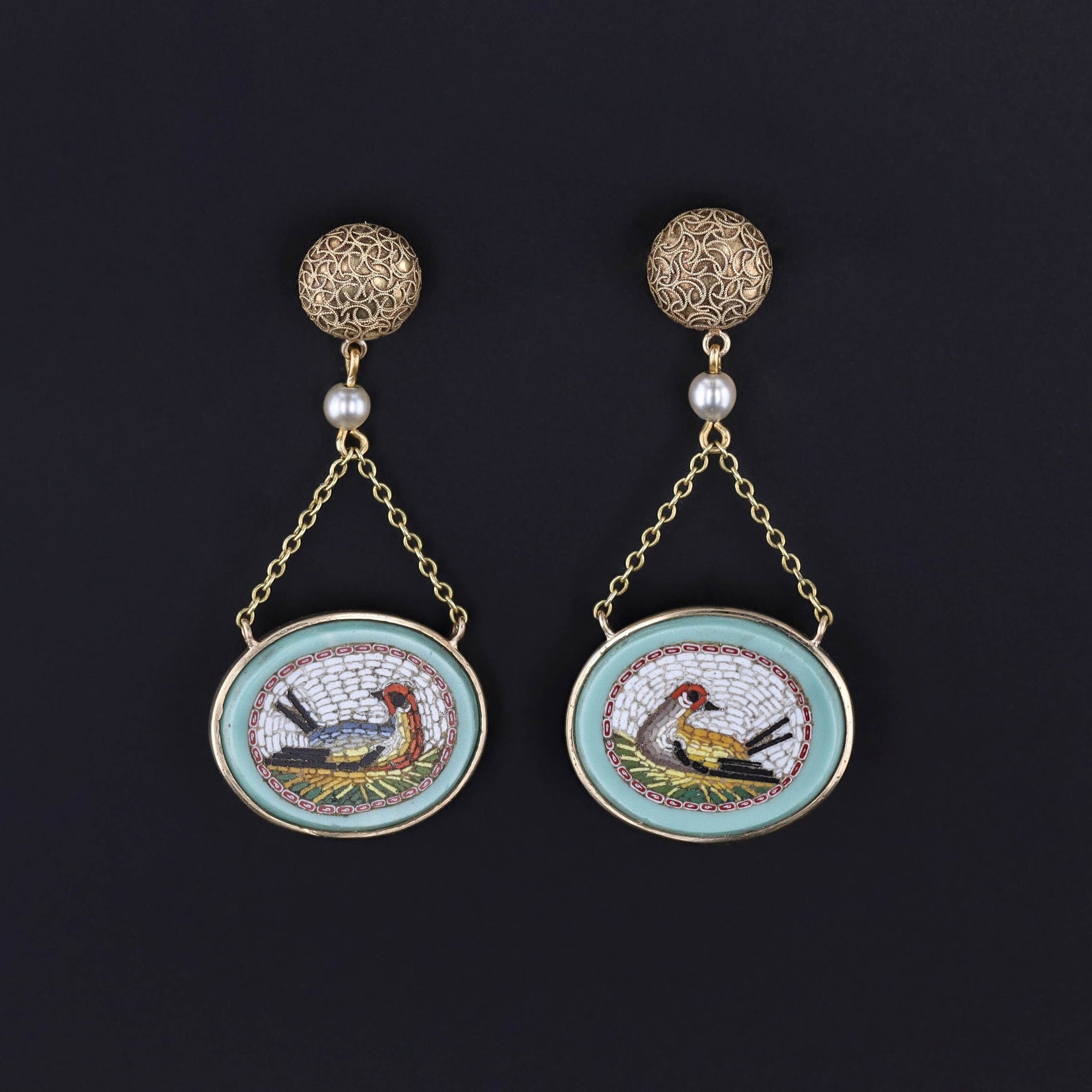 A pair of antique micromosaic bird earrings created with pearl accents.