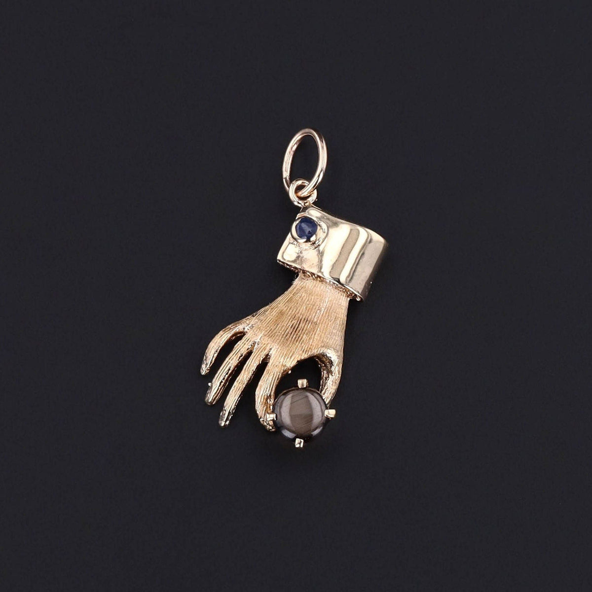 Vintage Hand Holding Gray Star Sapphire Charm of 14k Gold - Trademark Antiques