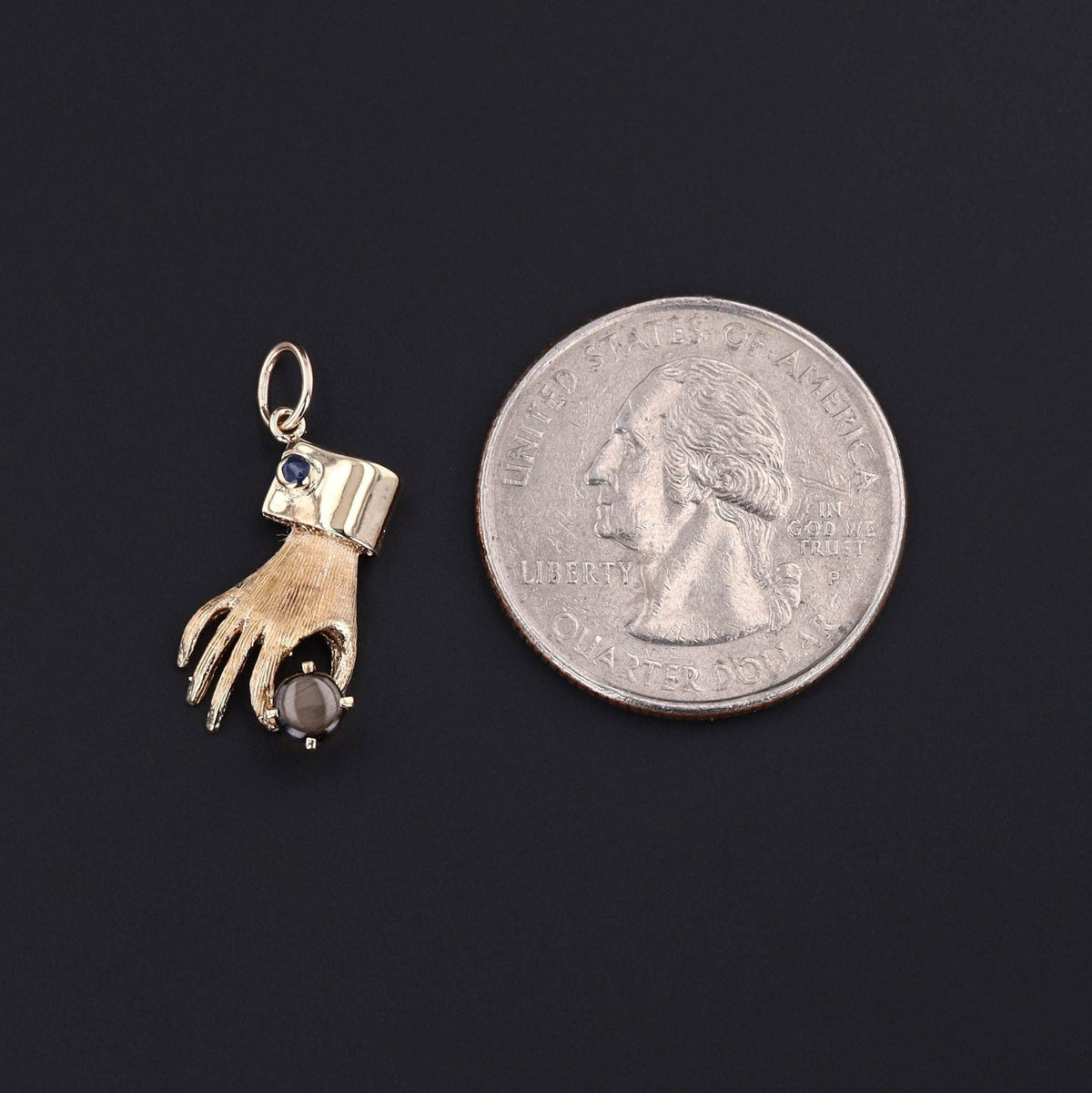 Vintage Hand Holding Gray Star Sapphire Charm of 14k Gold - Trademark Antiques