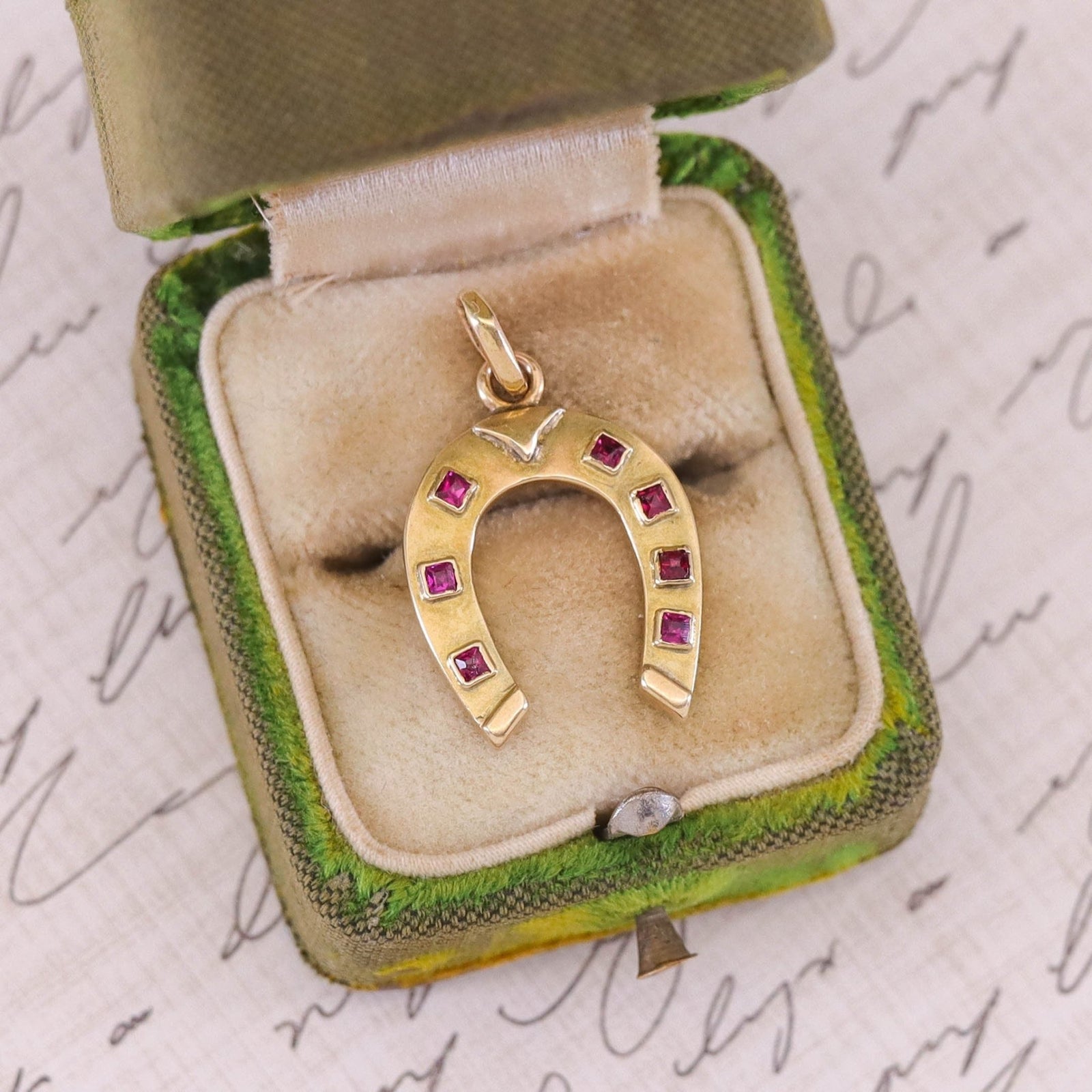 Vintage Ruby Horseshoe Pendant of 14k Gold - Trademark Antiques